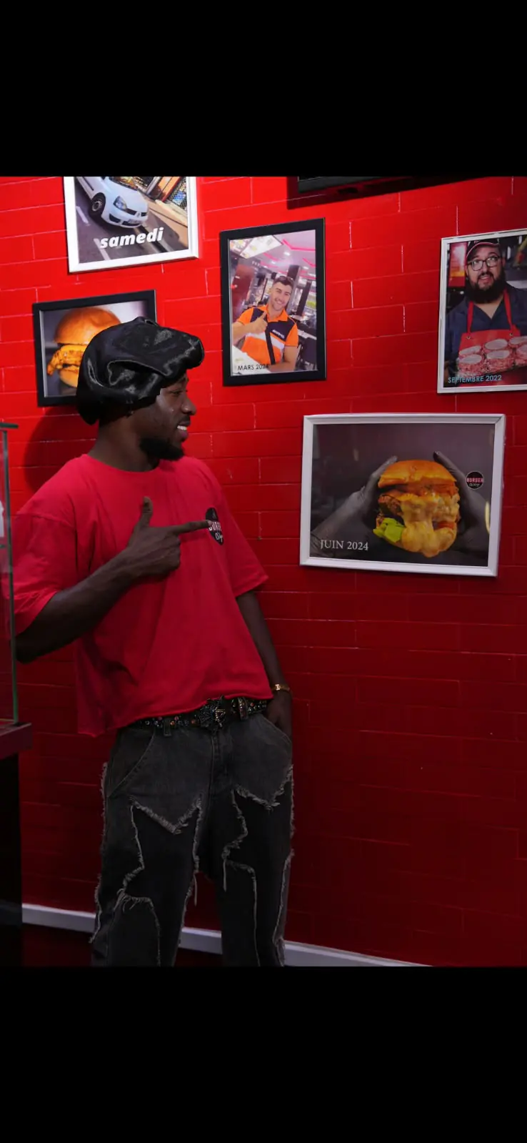 Le mur de photos de la maison Burger Ch’Waya
